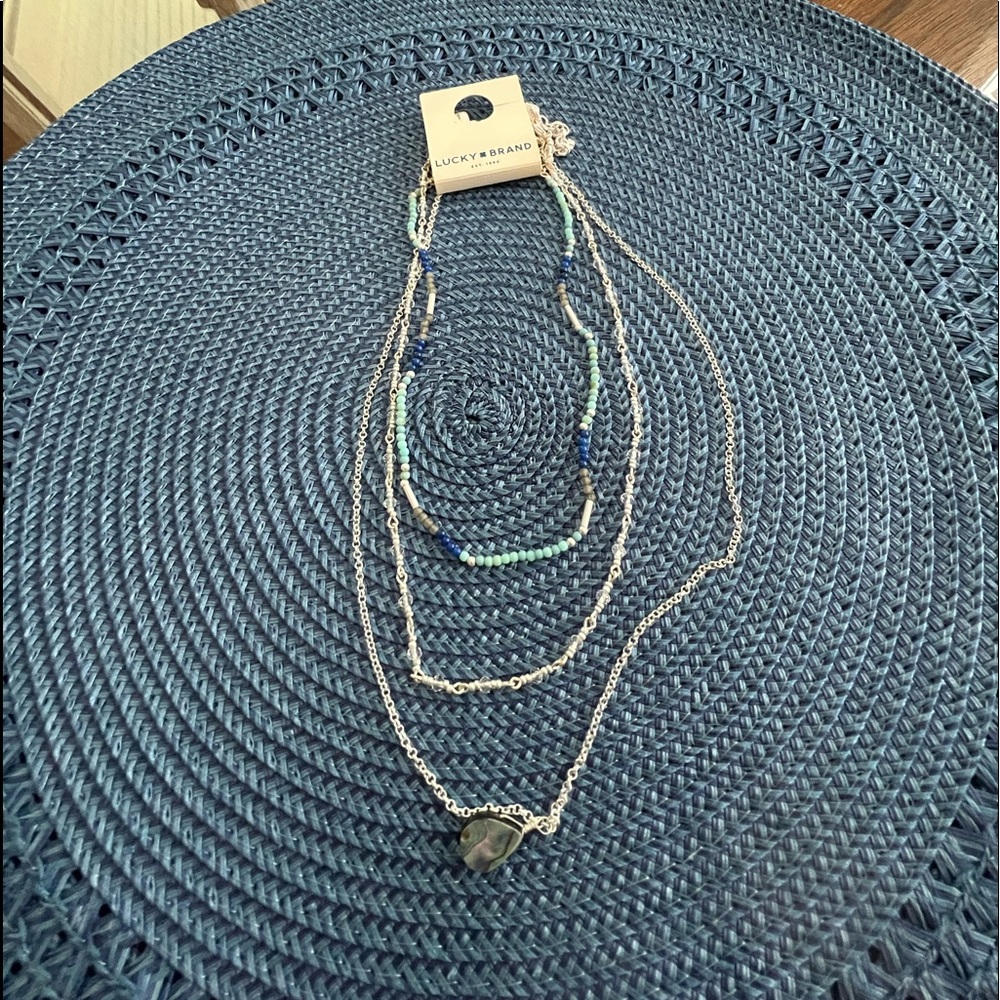 NWT lucky Brand beautiful adjustable necklace. Can wear separate or all three